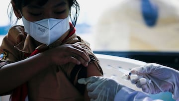 A child receives a dose of China&#039;s Sinovac Biotech vaccine against the coronavirus during a mass vaccination program for children aged 6-11 years, as the Omicron variant continues to spread in Jakarta, Indonesia. 