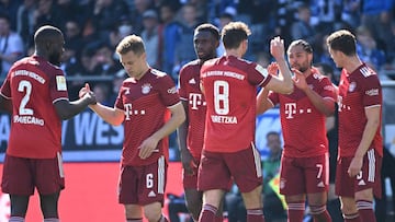 Bayern&#039;s players celebrate Bayern Munich&#039;s German midfielder Serge Gnabry (2nd R) scoring the 0-2 goal during the German first division Bundesliga football match Arminia Bielefeld v Bayern Munich in Bielefeld, western Germany, on April 17, 2022.