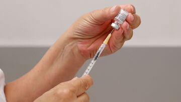 A medic prepares a dose of the Pfizer/BioNTech Covid-19 vaccine at the Maccabi Healthcare Services in the coastal city of Tel Aviv on June 6, 2021, as Israel begins coronavirus vaccination campaign for 12 to 15-year-olds. (Photo by JACK GUEZ / AFP)