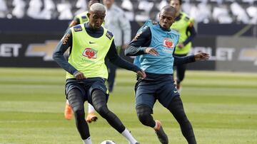 Brazil's Fernandinho, right, and Talisca, left, challenge for the ball during a training session in Berlin, Germany, Monday, March 26, 2018. Brazil will face Germany for an international friendly soccer match on Tuesday, March 27, 2018 in Berlin. (AP