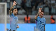 Argentina's midfielder Leandro Paredes (L) and Argentina's midfielder Rodrigo De Paul wave at the crowd before the friendly football match between Argentina and Curacao at the Madre de Ciudades stadium in Santiago del Estero, in northern Argentina, on March 28, 2023. (Photo by JUAN MABROMATA / AFP)