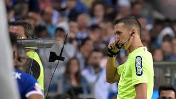 Referee calls officials to overturn late penalty