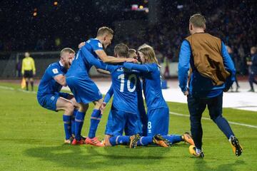 Iceland's players celebrate...