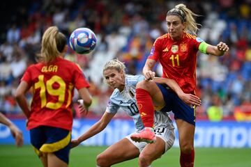 Spain's midfielder #11 Alexia Putellas (R) fights for the ball with Belgium's forward #10 Justine Vanhaevermaet (C) during the UEFA Women's Euro 2025 Qualifying football match between Spain and Belgium at the Riazor stadium in Coruna, northern Spain, on July 16, 2024. (Photo by MIGUEL RIOPA / AFP)