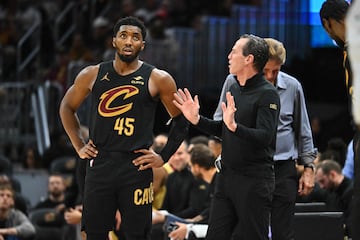 Donovan Mitchell #45 talks to head coach Kenny Atkinson