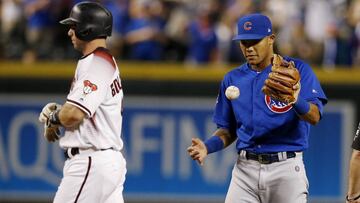 Chicago Cubs shortstop Addison Russell, right, flips the ball in the air after tagging out Arizona Diamondbacks&#039; Paul Goldschmidt, left, trying to steal second base for the final out during the ninth inning of a baseball game, Monday, Sept. 17, 2018, in Phoenix. The Cubs defeated the Diamondbacks 5-1. (AP Photo/Ross D. Franklin)