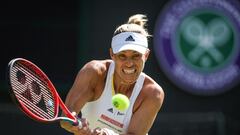 (FILES) In this file photograph taken on July 1, 2022, Germany's Angelique Kerber returns the ball to Belgium's Elise Mertens during their women's singles tennis match on the fifth day of the 2022 Wimbledon Championships at The All England Tennis Club in Wimbledon, southwest London. - Former women's world number one Angelique Kerber announced on August 24, 2022, that she is pregnant and has withdrawn from next week's US Open joking "two against one just isn't a fair competition." The 34-year-old German added that Flushing Meadow holds great memories for her. She won the title there in 2016 and, as a result, became world number one. (Photo by Adrian DENNIS / AFP) / RESTRICTED TO EDITORIAL USE