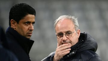 Paris Saint Germain's Portuguese Football Advisor Luis Campos (R) and Paris Saint Germain's Qatari president Nasser al-Khelaifi speak on the sidelines of a training session on the eve of the UEFA Champions League round of 16, 2nd-leg football match FC Bayern Munich v Paris Saint-Germain FC in Munich, southern Germany, on March 7, 2023. (Photo by FRANCK FIFE / AFP)