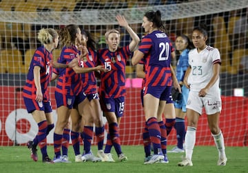 Kristie Mewis of the U.S. celebrates scoring their first goal with Megan Rapinoe and teammates 