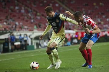 (L-R) Francisco Cordova of America and Alejandro Manuel Mayorga of Guadalajara during the game Guadalajara vs America, corresponding to Eleventh round match and Edition 240 of the National Classic of the Torneo Guard1anes Clausura 2021 of the Liga BBVA MX, at the Akron Stadium, on March 14, 2021.
<br><br>
(I-D), Francisco Cordova de America y Alejandro Manuel Mayorga de Guadalajara durante el partido Guadalajara vs America, correspondiente a la Jornada 11 y Edicion 240 del Clasico Nacional del Torneo Clausura Guard1anes 2021 de la Liga BBVA MX, en el Estadio Akron, el 14 de Marzo de 2021.