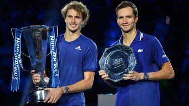 Germany's Alexander Zverev and Russia's Daniil Medvedev pose after their final match of the ATP Finals at the Pala Alpitour venue in Turin on November 21, 2021. (Photo by Marco BERTORELLO / AFP)