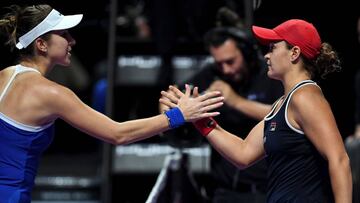Ashleigh Barty of Australia greets Belinda Bencic of Switzerland after winning their women&#039;s singles first round match in the WTA Finals tennis tournament in Shenzhen on October 27, 2019. (Photo by NOEL CELIS / AFP)