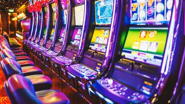 Line of electronic slot machines in casino. Property released.