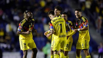 America's French forward #97 Allan Saint-Maximin (L) celebrates with teammates after scoring the opening goal during the Liga MX Apertura football match between America and Leon at the Ciudad de los Deportes Stadium in Mexico City on November 1, 2025. (Photo by Rodrigo Oropeza / AFP)