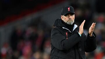 Liverpool's German manager Jurgen Klopp claps the fans after the English FA Cup third round football match between Liverpool and Wolverhampton Wanderers at Anfield in Liverpool, north-west England on January 7, 2023. (Photo by Oli SCARFF / AFP) / RESTRICTED TO EDITORIAL USE. No use with unauthorized audio, video, data, fixture lists, club/league logos or 'live' services. Online in-match use limited to 120 images. An additional 40 images may be used in extra time. No video emulation. Social media in-match use limited to 120 images. An additional 40 images may be used in extra time. No use in betting publications, games or single club/league/player publications. / 