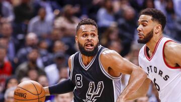 Jan 24, 2017; Toronto, Ontario, CAN; San Antonio Spurs guard Patty Mills (8) dribbles the all around Toronto Raptors guard Cory Joseph (6) in the second half at Air Canada Centre. Spurs defeat the Raptors 108-106.  Mandatory Credit: Kevin Sousa-USA TODAY Sports