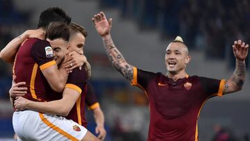 Diego Perotti (l) celebrates with teammates after scoring against Fiorentina. 