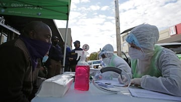 A City of Tshwane Health official conduct a screening exercise on a taxi operator before testing for coronavirus at the Bloed Street Mall in Pretoria Central Business District. 