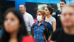 A woman wears a protective face mask as a protective measure against the outbreak of the coronavirus disease (COVID-19) as she walks at the Constitution train station, in Buenos Aires, Argentina March 17, 2020. REUTERS/Agustin Marcarian