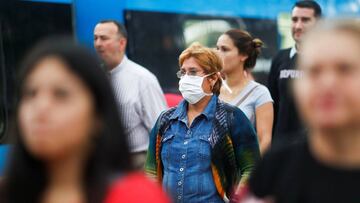 A woman wears a protective face mask as a protective measure against the outbreak of the coronavirus disease (COVID-19) as she walks at the Constitution train station, in Buenos Aires, Argentina March 17, 2020. REUTERS/Agustin Marcarian