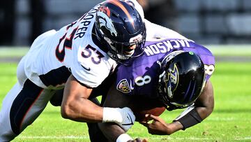 BALTIMORE, MARYLAND - DECEMBER 04: Jonathon Cooper #53 of the Denver Broncos sacks Lamar Jackson #8 of the Baltimore Ravens in the first half at M&T Bank Stadium on December 04, 2022 in Baltimore, Maryland. Greg Fiume/Getty Images/AFP (Photo by Greg Fiume / GETTY IMAGES NORTH AMERICA / Getty Images via AFP)