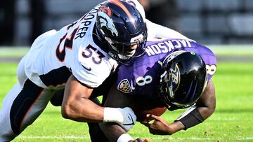 BALTIMORE, MARYLAND - DECEMBER 04: Jonathon Cooper #53 of the Denver Broncos sacks Lamar Jackson #8 of the Baltimore Ravens in the first half at M&T Bank Stadium on December 04, 2022 in Baltimore, Maryland.   Greg Fiume/Getty Images/AFP (Photo by Greg Fiume / GETTY IMAGES NORTH AMERICA / Getty Images via AFP)