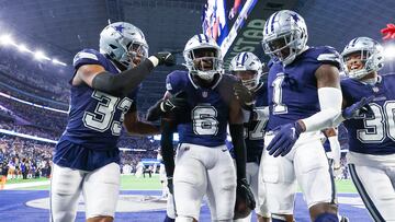 Dec 30, 2023; Arlington, Texas, USA; Dallas Cowboys safety Donovan Wilson (6) celebrates with teammates after making an interception during the second half against the Detroit Lions at AT&T Stadium. Mandatory Credit: Kevin Jairaj-USA TODAY Sports