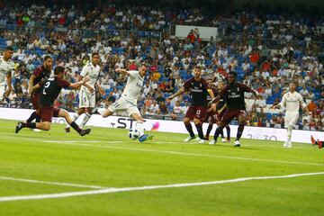 Bale (centre) puts Real back in front on the stroke of half time.