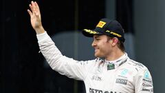 SAO PAULO, BRAZIL - NOVEMBER 13:  Nico Rosberg of Germany and Mercedes GP celebrates finishing in second place on the podium during the Formula One Grand Prix of Brazil at Autodromo Jose Carlos Pace on November 13, 2016 in Sao Paulo, Brazil.  (Photo by Mark Thompson/Getty Images)