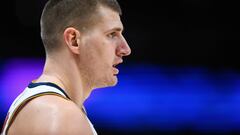 DENVER, CO - DECEMBER 10: Nikola Jokic #15 of the Denver Nuggets looks on during an NBA game at Pepsi Center on December 10, 2022 in Denver, Colorado. NOTE TO USER: User expressly acknowledges and agrees that, by downloading and or using this photograph, User is consenting to the terms and conditions of the Getty Images License Agreement.   Dustin Bradford/Getty Images/AFP (Photo by Dustin Bradford / GETTY IMAGES NORTH AMERICA / Getty Images via AFP)