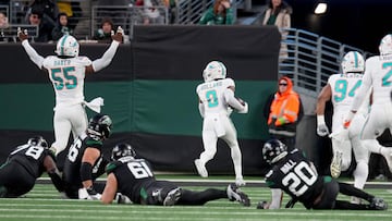EAST RUTHERFORD, NEW JERSEY - NOVEMBER 24: Jevon Holland #8 of the Miami Dolphins scores a 99 yard touchdown off of an interception thrown by Tim Boyle #7 of the New York Jets during the second quarter in the game at MetLife Stadium on November 24, 2023 in East Rutherford, New Jersey. Mike Stobe/Getty Images/AFP (Photo by Mike Stobe / GETTY IMAGES NORTH AMERICA / Getty Images via AFP)