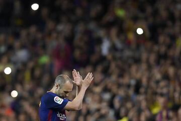 Iniesta applauds the Barcelona fans as he is substituted during Sunday's LaLiga clash against Real Madrid - his final Clásico.