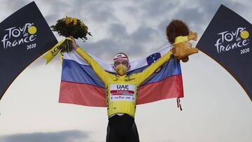 Cycling - Tour de France - Stage 21 - Mantes-la-Jolie to Paris Champs-Elysees - France - September 20, 2020. UAE Team Emirates rider Tadej Pogacar of Slovenia celebrates on the podium, after winning the general classification and the overall leader&#039;s