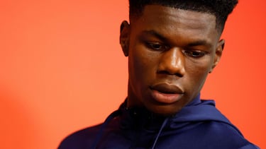 (FILES) France's midfielder #08 Aurelien Tchouameni arrives for a press conference at the Johan Cruijff stadium, in Amsterdam on October 12, 2023 on the eve of their UEFA Euro 2024 group B qualification football match against Netherlands. Tchouameni's club Real Madrid announced on October 29, 2023, that the French international has a broken metatarsal bone on his left foot, after the match his team won against Barcelona, leading him to miss the two next matches of the French national team. (Photo by Kenzo TRIBOUILLARD / AFP)