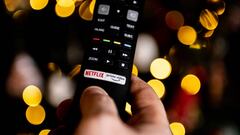 POLAND - 2023/01/06: In this photo illustration a tv remote with Netflix logo is seen in a person's hand. (Photo Illustration by Mateusz Slodkowski/SOPA Images/LightRocket via Getty Images)