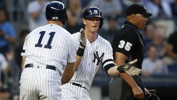 NEW YORK, NEW YORK - MAY 31: Home plate umpire Jeremie Rehak looks on as DJ LeMahieu #26 and Brett Gardner #11 of the New York Yankees celebrate after both scored during the third inning against the Boston Red Sox at Yankee Stadium on May 31, 2019 in New York City.   Jim McIsaac/Getty Images/AFP
 == FOR NEWSPAPERS, INTERNET, TELCOS &amp; TELEVISION USE ONLY ==