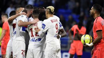 Lyon's players celebrates after scoring a goal during the French L1 football match between Lyon (OL) and Caen (SMC) on March 11, 2018, at the Groupama Stadium in Decines-Charpieu, near Lyon, southeastern France. / AFP PHOTO / JEAN-PHILIPPE KSIAZEK