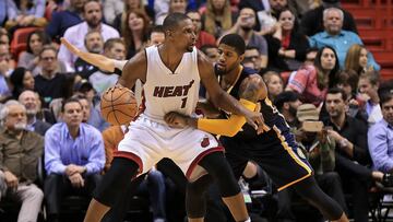 Paul George defendiendo a Chris Bosh en un encuentro del año pasado