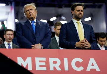 Republican presidential nominee and former U.S. President Donald Trump stands alongside vice presidential nominee J.D. Vance as they attend Day 2 of the Republican National Convention (RNC), at the Fiserv Forum in Milwaukee, Wisconsin, U.S., July 16, 2024. REUTERS/Elizabeth Frantz
