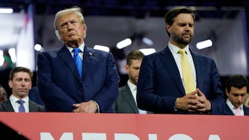 Republican presidential nominee and former U.S. President Donald Trump stands alongside vice presidential nominee J.D. Vance as they attend Day 2 of the Republican National Convention (RNC), at the Fiserv Forum in Milwaukee, Wisconsin, U.S., July 16, 2024. REUTERS/Elizabeth Frantz