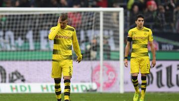 Dortmund's Ukrainian midfielder Andrej Jarmolenko (L) and Dortmund's Spanish defender Marc Bartra react during the German First division Bundesliga football match Hanover 96 vs Borussia Dortmund in Hanover, nothern Germany, on October 28, 2017. / AFP PHOTO / PATRIK STOLLARZ