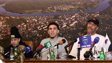 US basketball player (L-R) LaMelo Ball, LiAngelo Ball and their father LaVar Ball attend a press conference in Prienai, Lithuania, where they will play for the Vytautas club on January 5, 2018.
Basketball-crazed Lithuania welcomed LiAngelo and LaMelo Ball, the two youngest sons of flamboyant Los Angeles entrepreneur LaVar Ball who recently made headlines due to a feud with US President Donald Trump. / AFP PHOTO / Petras Malukas