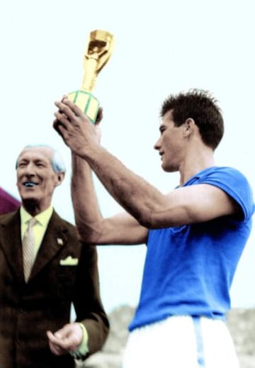 The Canarinha won the first of their World Cup titles in June 29, beating host nation Sweden 5-2 in Solna. Brazil captain Bellin is pictured with the trophy.