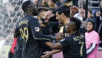 Los Angeles FC forward Carlos Vela, second from right, of Mexico, celebrates his goal with teammates in the second half of an MLS soccer match against Portland Timbers in Los Angeles, Sunday, March 10, 2019. The Los Angeles FC won 4-1. (AP Photo/Ringo H.W. Chiu)