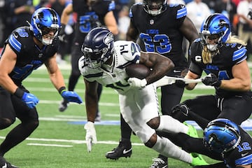 Seattle Seahawks wide receiver DK Metcalf attempts to break multiple tackles against the Detroit Lions