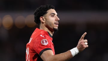 Egypt's forward #22 Omar Marmoush celebrates scoring the team's first goal during the Africa Cup of Nations (CAN) group B football match between Egypt and Zimbabwe at Adrar Stadium in Agadir on December 22, 2025. (Photo by FRANCK FIFE / AFP)