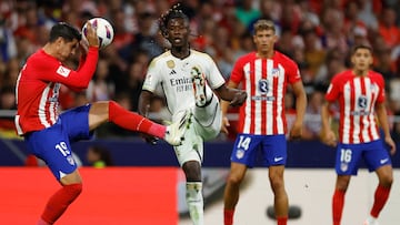 Atletico Madrid's Spanish forward #19 Alvaro Morata vies with Real Madrid's French midfielder #12 Eduardo Camavinga during the Spanish Liga football match between Club Atletico de Madrid and Real Madrid CF at the Metropolitano stadium in Madrid on September 24, 2023. (Photo by OSCAR DEL POZO / AFP)