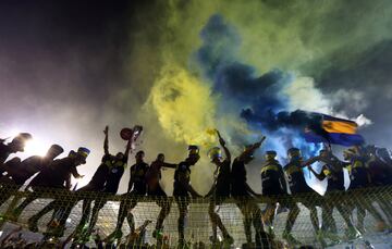 Boca Juniors' players celebrate with the trophy after they clinched the Argentine tournament. 