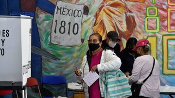 People vote at a polling station during a national referendum on the revocation of the mandate of Mexican President Andres Manuel Lopez Obrador, Mexico City, on April 10, 2022. - Mexicans will vote Sunday in a divisive national referendum championed by President Andres Manuel Lopez Obrador on whether he should step down or complete his six-year term. (Photo by Alfredo ESTRELLA / AFP) (Photo by ALFREDO ESTRELLA/AFP via Getty Images)