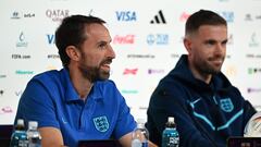 England's coach Gareth Southgate (L) and England's midfielder Jordan Henderson give a press conference at the Qatar National Convention Center (QNCC) in Doha on November 28, 2022, on the eve of the Qatar 2022 World Cup football match between Wales and England. (Photo by Paul ELLIS / AFP)
